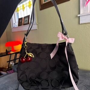 Coach Black Shoulder Bag with Pink Bow and Cherry Charm